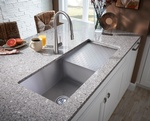 Kitchen sink with cover on Granite Countertop designed by Old Castle Home Design Center