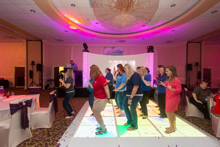 Corporate Event team building activity with participants dancing together organized by Houston Event Planning