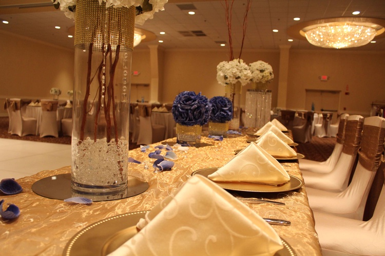 Formal table setting with intricate folded napkins and menu cards by Houston Event Planning