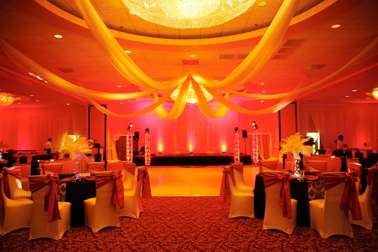 Red and gold sparkling lights illuminating a birthday celebration organized by Houston Event Planning