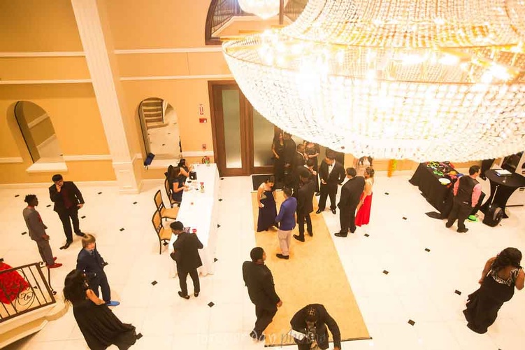 Prom venue entrance with carpet under the disco ball organized by Houston Event Planning