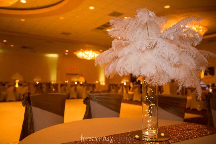 Personalized centerpieces with flowers and lighting organized by Houston Event Planning