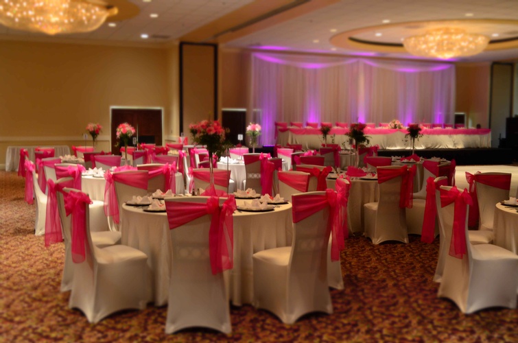 Quinceañera table with vibrant pink colors and crystal details done by Houston Event Planning