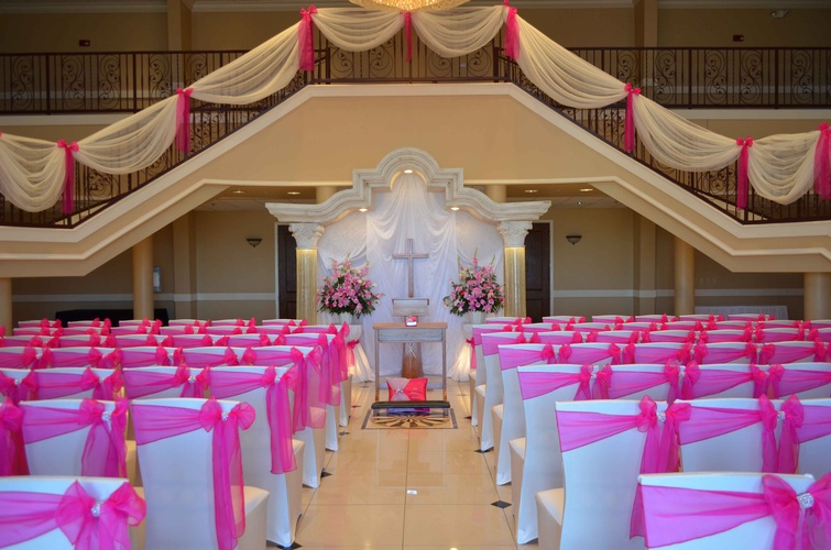 Quinceañera court walking down a grand staircase and an altar done by Houston Event Planning