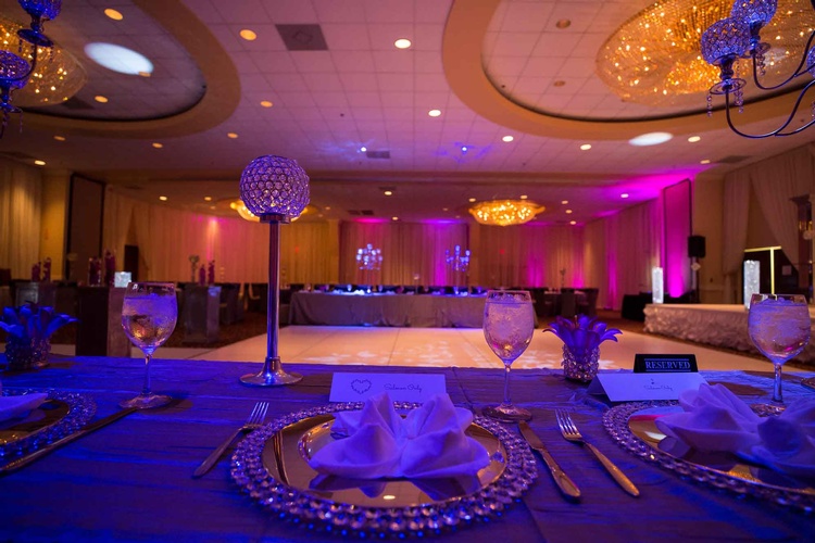 Guest table set up with intricate design done by Houston Event Planning