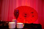 Table setting with white plates and a decorative table for a birthday party organized by Houston Event Planning