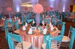 Table setting with a Quinceañera theme and pink flowers done by Houston Event Planning
