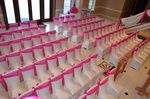 Elegant chair decorations with pink throws for a Quinceañera event done by Houston Event Planning
