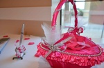 Quinceañera-themed props and decorations and pen for guests to sign organized by Houston Event Planning