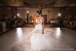 Bride's wedding dress and holding bouquet of flowers captured by Houston Event Planning