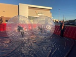 Community Event Planning with a transparent inflatable water rolling ball