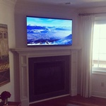 OLED over a fireplace