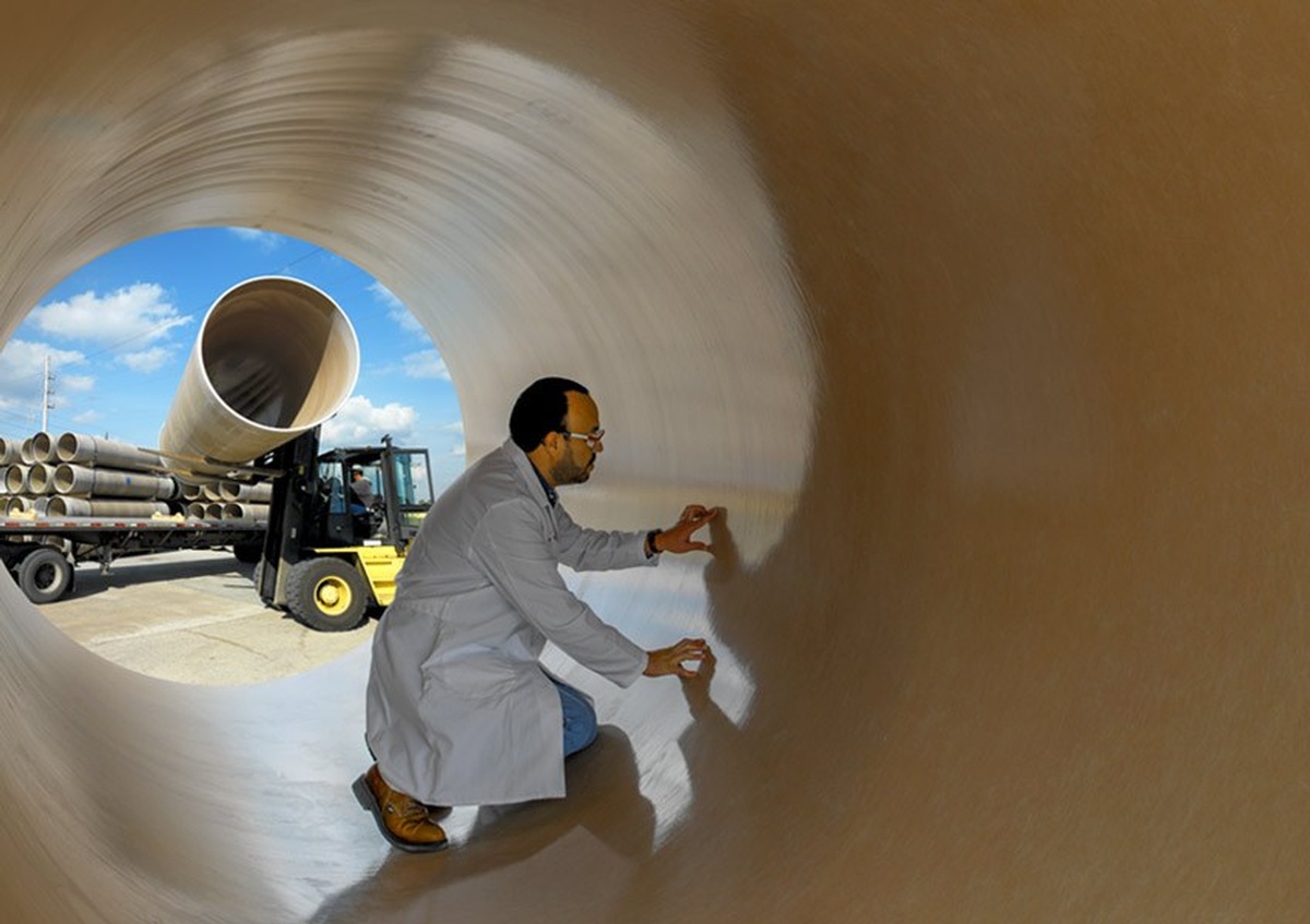 Man Inside a Pipe  - Photograph by Commercial Photographer Houston TX, Joe Robbins