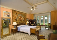 Hotel room interior with a painting hanging above the bed - Architectural Photography by Joe Robbins in Houston