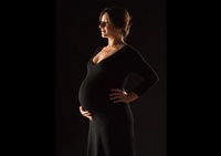 Maternity Photoshoot of a woman dressed in black - Professional Photography in Houston by Joe Robbins