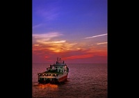 Sailing Boat at Sunset captured by Joe Robbins - Corporate Photographer Houston
