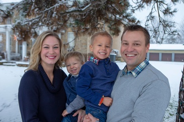 Smiling Parents with two young sons Captured by Family Photographer Minneapolis - Mode T Productions