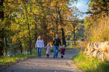 Family Walking on Pathway Surrounded by Trees - Professional Photography Services by Family Photographer Farmington
