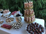 A bottle of wine among sweets and fruit salad at a Wedding Catering Tacoma by Christie's Catering