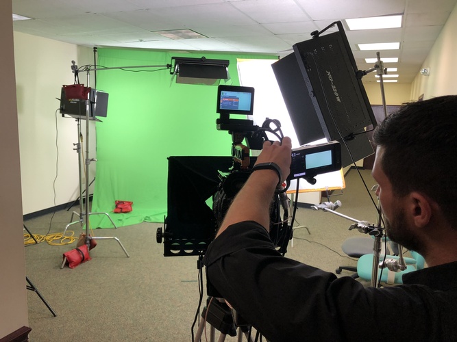 Video Shooting on a Green Screen background by Merlin Productions LLC