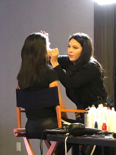 Makeup being done for a female artist