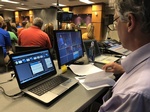 A Crew member working on a Presentation and Video Editing project in the studio