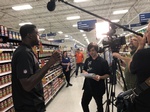 Videographer at a Merchandise Store shooting a video