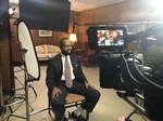 An interview being shot by Merlin Productions LLC videographer in an office