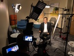 Interview of a man inside an office recorded by Merlin Productions LLC Crew