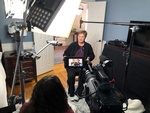 Interview of a lady being captured by Videographers at Merlin Productions LLC at her home 