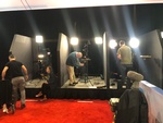 Merlin Productions LLC crew setting up the video recording equipment on a red carpet area
