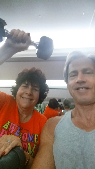 A Women lifting Dumbbells with Marty Burger - Personal Trainer  Hollywood