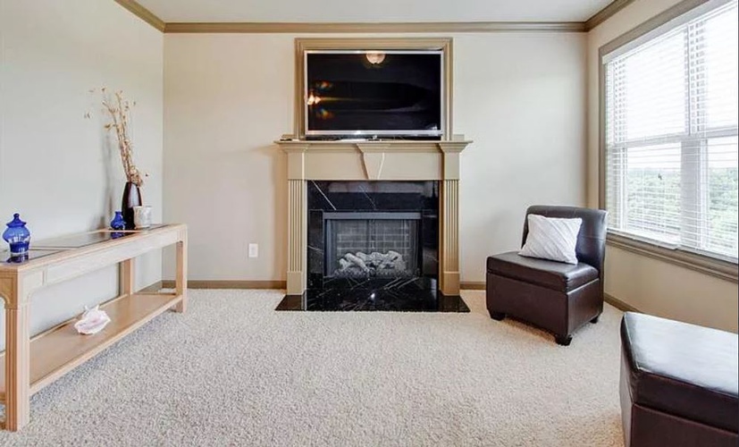 Room with a Fireplace and Carpet Flooring - Home Staging Hamilton by Sage Key Interiors