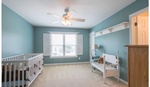 Kids Room with a Chandelier Fan and a Wooden Sofa - Home Staging Services Wilson by Sage Key Interiors