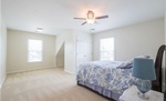 Bedroom with a Chandelier Fan and Carpet Flooring - Home Staging Wilson by Sage Key Interiors
