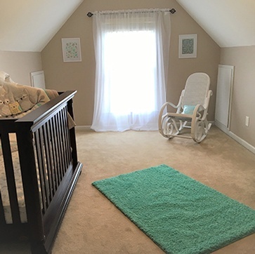 Kids Room with a Carpet Floor and a Rocking Chair - Home Staging Wilson by Sage Key Interiors