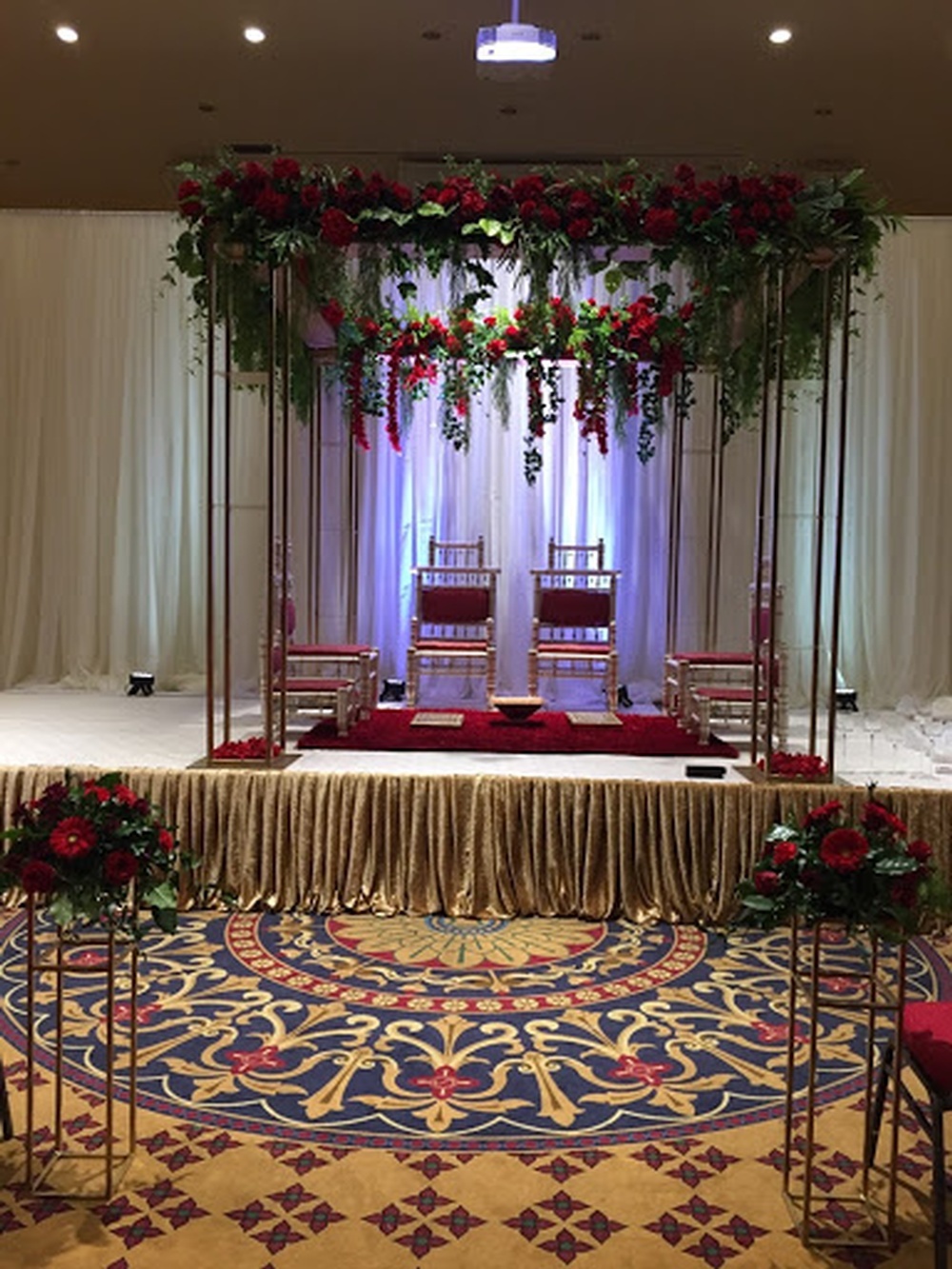 Wedding Stage Decorations with Red Roses by Design Mantraa-Decor and Florals - Event Decor Company in Toronto ON