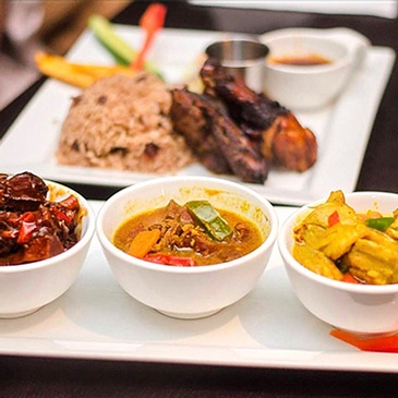 Savory Jamaican oxtail stew, slow-cooked to perfection for maximum flavor at Scotthill Caribbean Cuisine