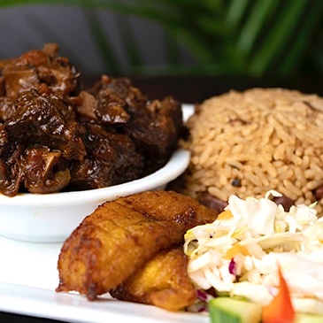 Grilled Jamaican Chicken, spicy and juicy with a smoky flavor at Scotthill Caribbean Cuisine
