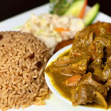 Exotic Jamaican-style rice and peas, a staple side dish bursting with spices at Scotthill Caribbean Cuisine