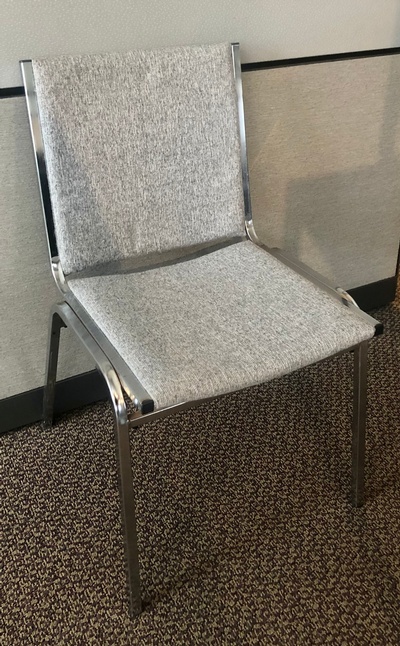 Used Armless Guest Chair with Gray Upholstery and Chrome Frame 