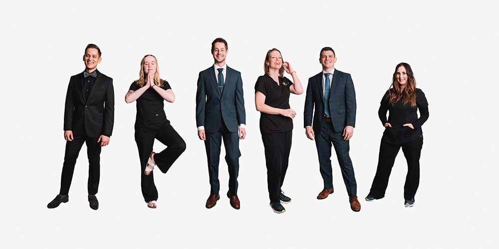 A Group of Team Posing With a Classy White Theme - Corporate Headshots by Headshot Photographer in Minneapolis