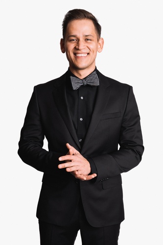 Man Posing in a Black Suit and Black Bow - Linked - In Headshots by Headshot Photographer in Minneapolis