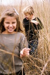 Kids Walking Happily in the Fields Captured by Steffen Sharikov - Commercial Photography Services Bloomington