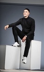 Man Posing in a Black Sweatshirt and Pant - Actor Headshots by Headshot Photographer in Minneapolis - Steffen Sharikov