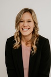 Woman Posing in a Black Suit with a Smiling Face - Professional Headshots by Headshot Photographer in Minneapolis 