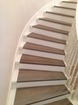 Curved Wooden Staircase by TJL Floor And Garage Door Inc - Richmond Flooring Store