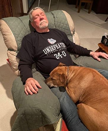 Bill-and-dog-sleeping.jpg