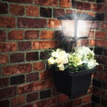 Solar Path Light with Planter GS-111PL mounted on the wall - Transportation Solutions and Lighting, Inc