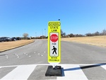 In-Street Pedestrian Crosswalk Sign on Roadways - Traffic Calming Products - Transportation Solutions and Lighting, Inc